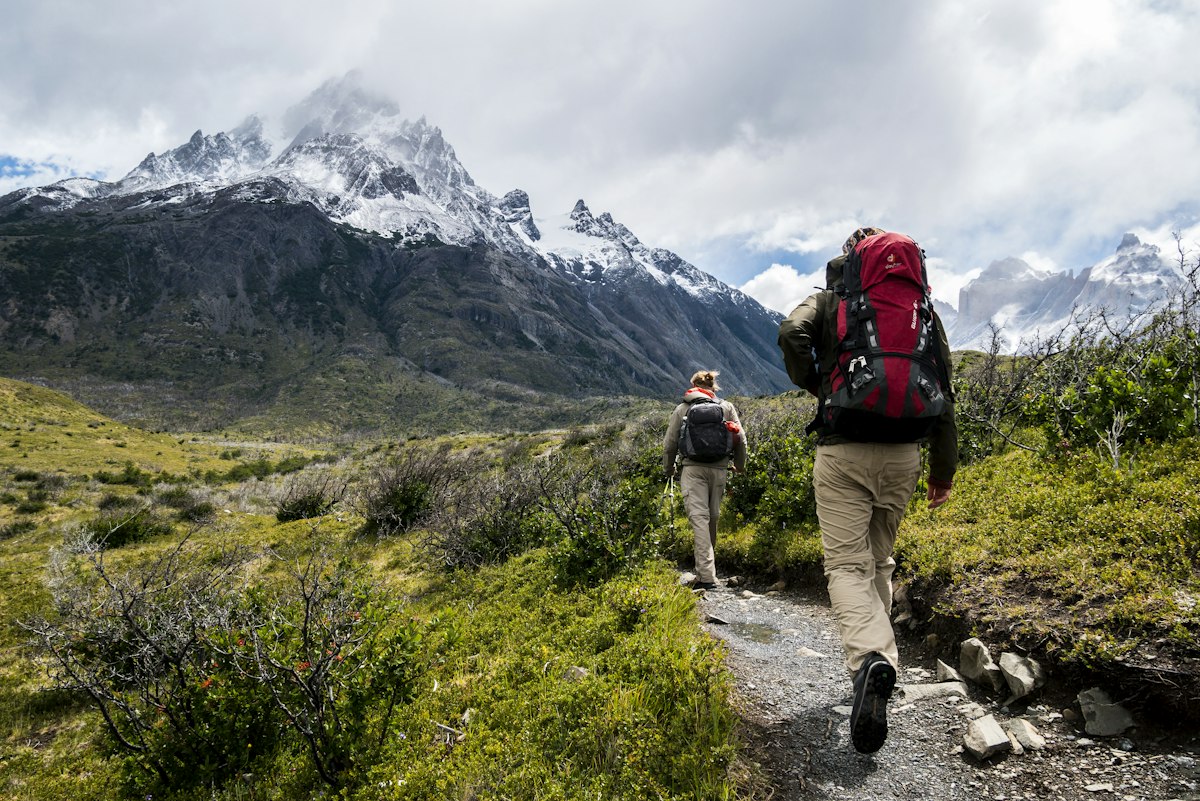 Hikers in boots on a mountain trail