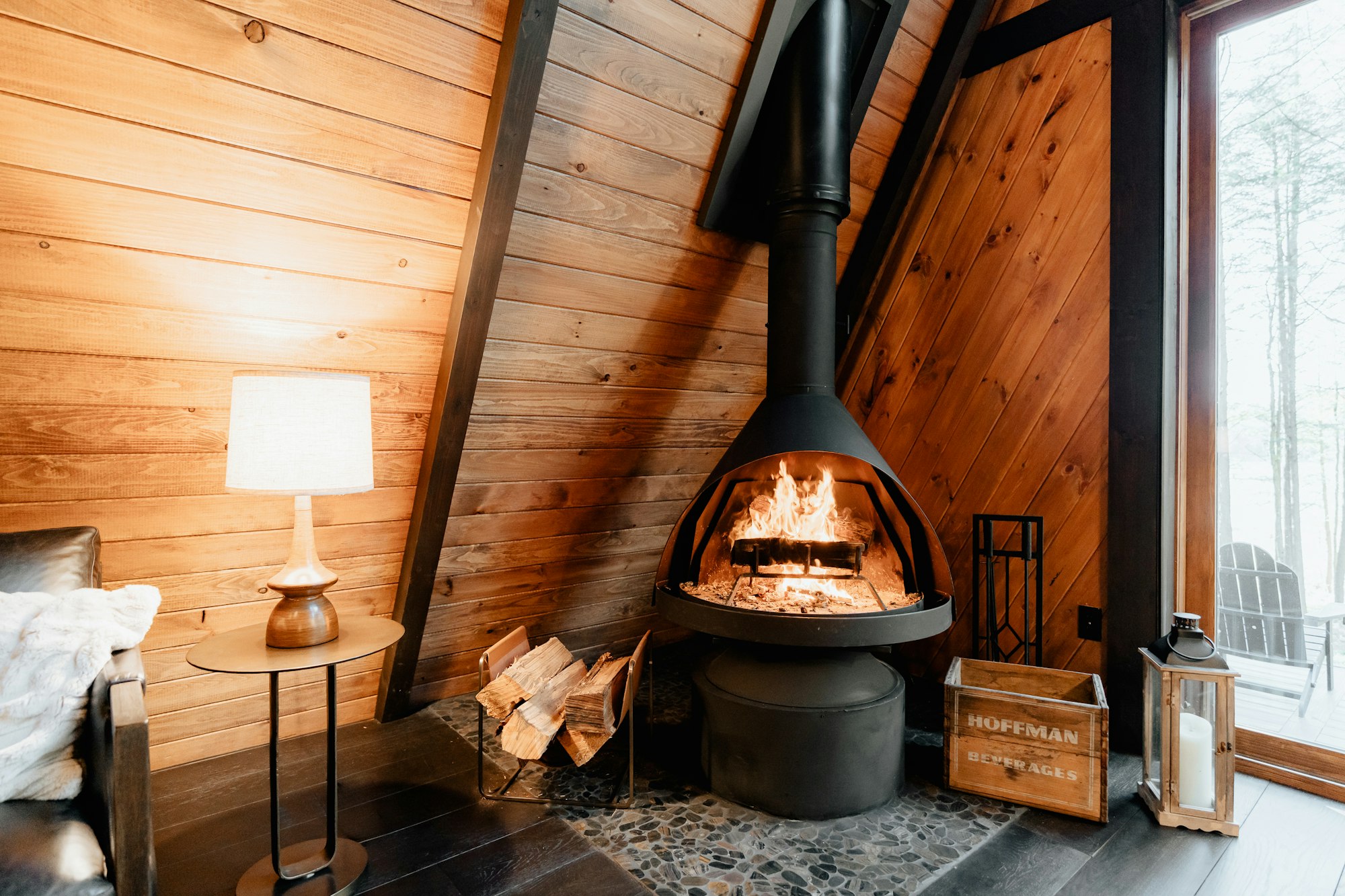 Wood-burning stove inside a wooden cabin